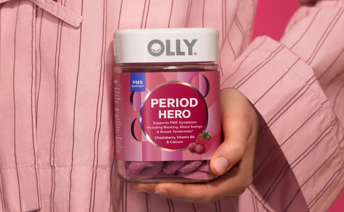 woman in nightgown holding OLLY Period Hero