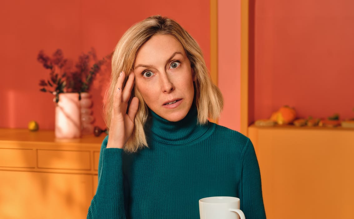 Woman holding coffee mug